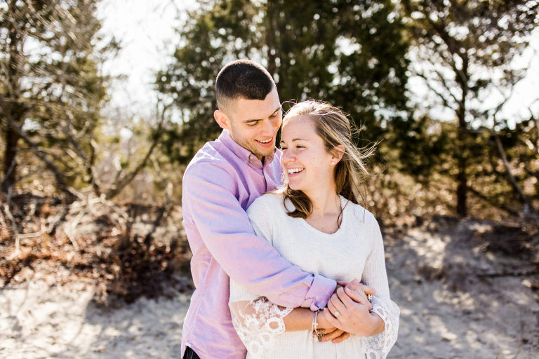 Couple embraces at Corsons Inlet engagement session