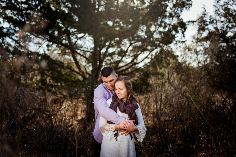 Couple poses for beautiful portrait during Corsons Inlet winter engagement with Kaleidoscope Imagery