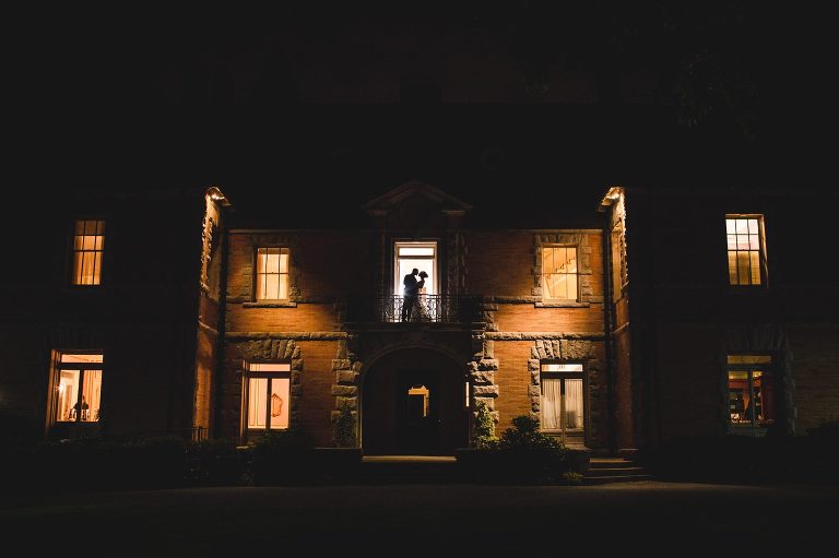 Bride and groom pose at night at Cairnwood Estate.