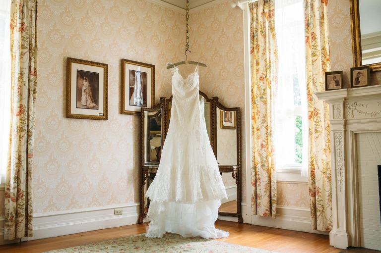 Wedding dress hangs in bridal suite at Cairnwood Estate