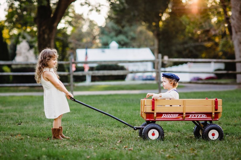 brother and sister in Washington Crossing Park with Radio Flyer Wagon