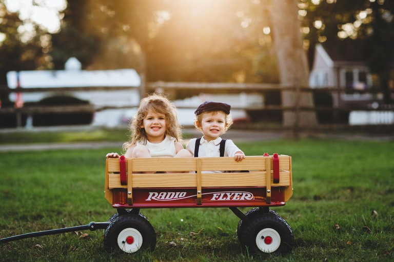 Children in Radio Flyer wagon at family portrait session in Bucks County, PA