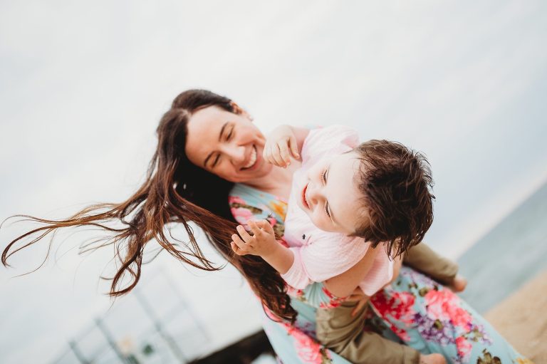 Mom and son share a genuine moment at Belmar beach session