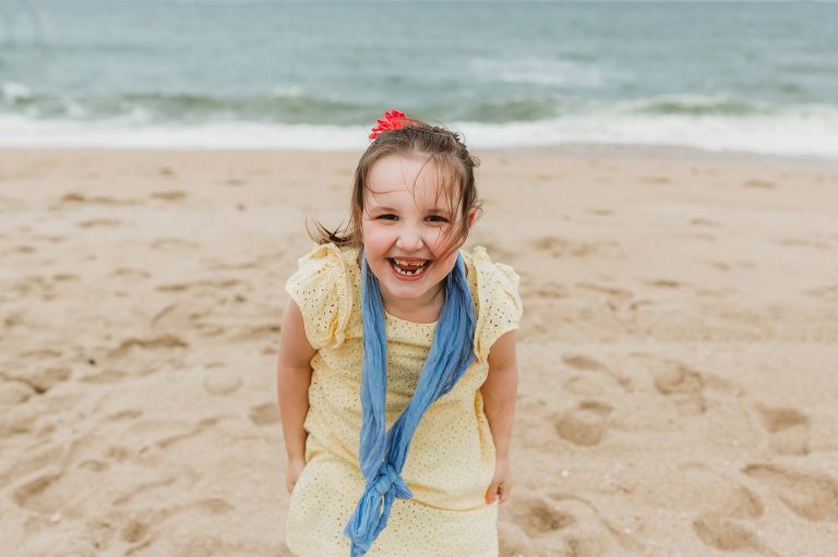 A girl smiles on the Belmar Beach