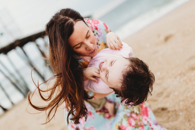 Mom and son have authentic moment at sunset portrait session at Jersey shore