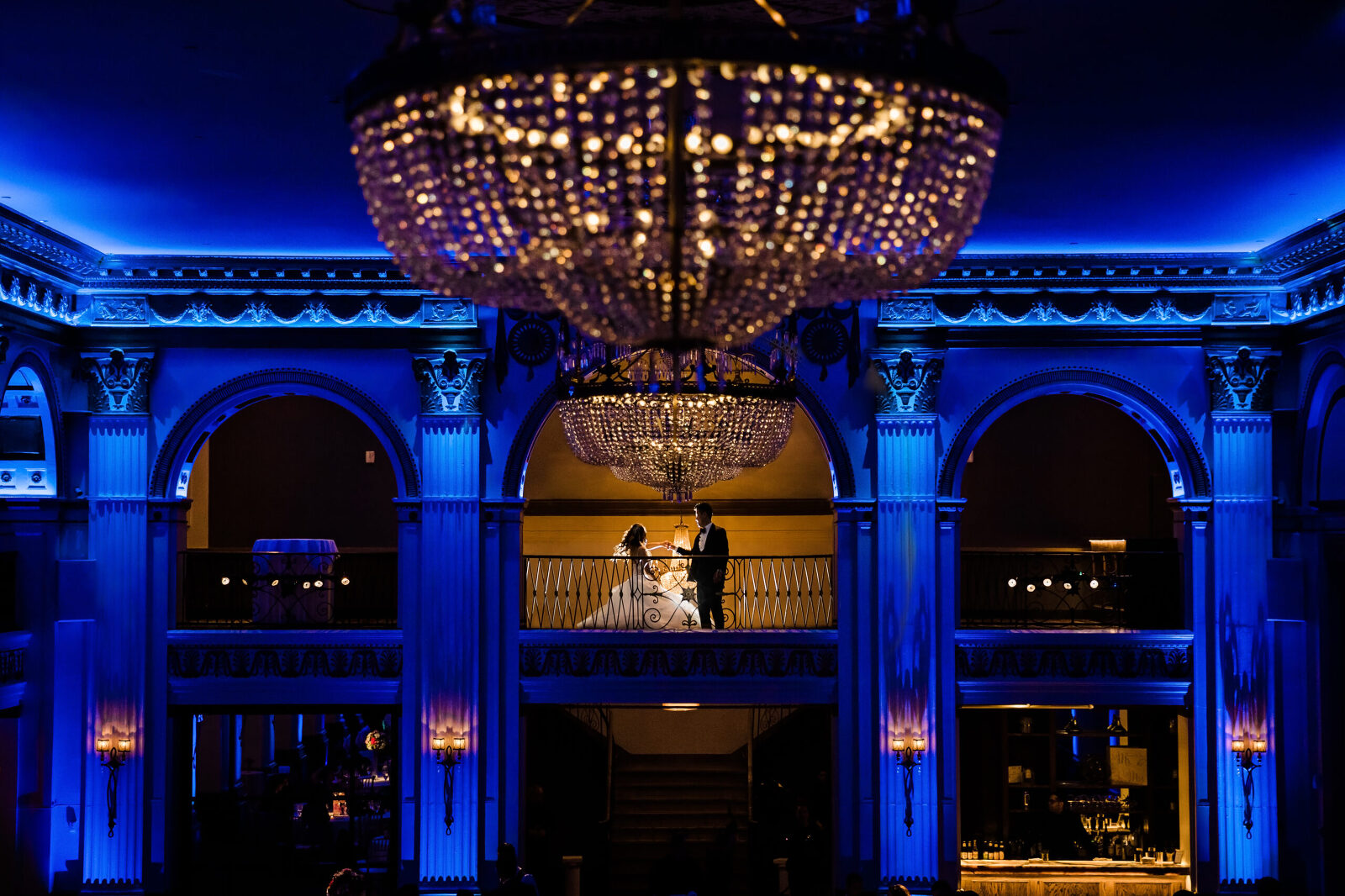 moody classic wedding portrait with blue up lighting for wedding photos